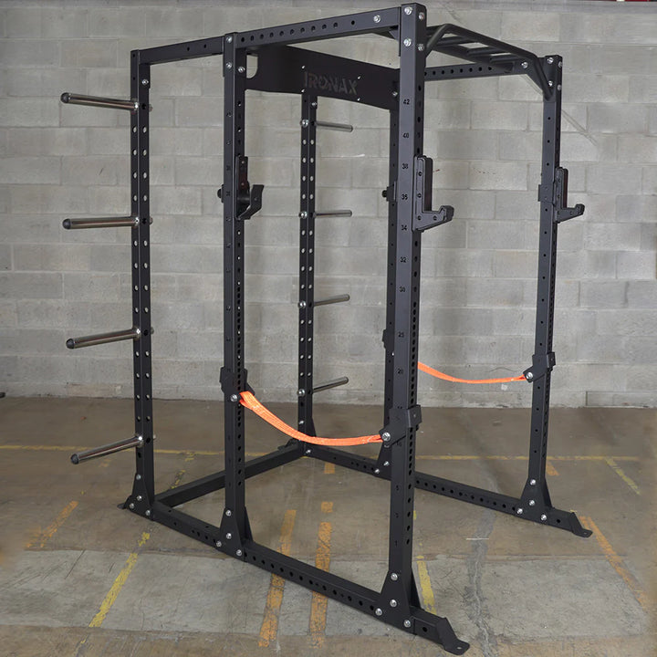 Safety slings attachment for power rack shown with rack and optional weight plate storage