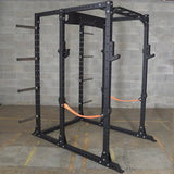 Safety slings attachment for power rack shown with rack and optional weight plate storage