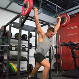 Man lifting weights in a gym setting